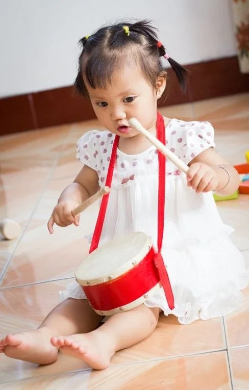 Girl playing drum